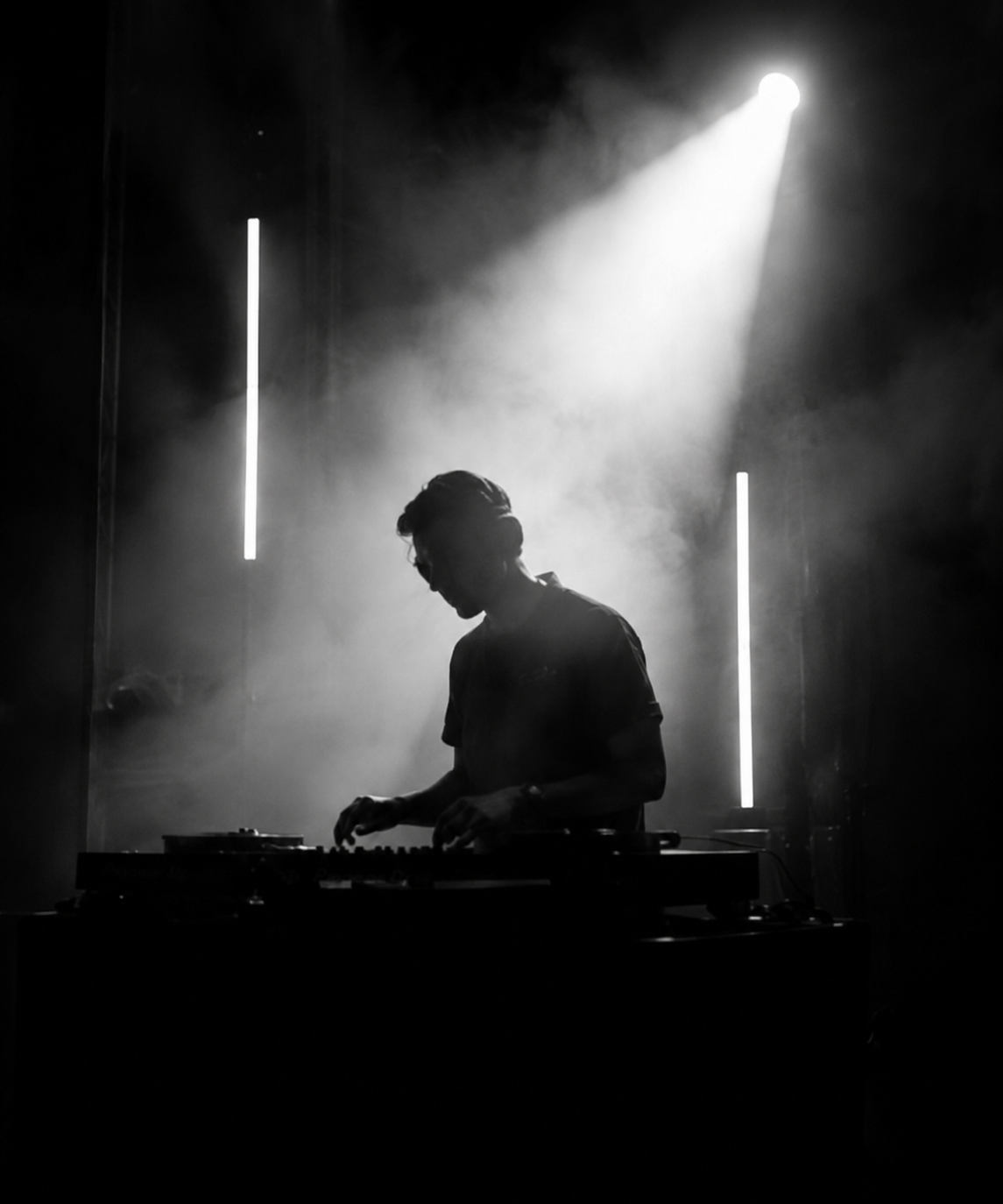 DJ performing live with beams