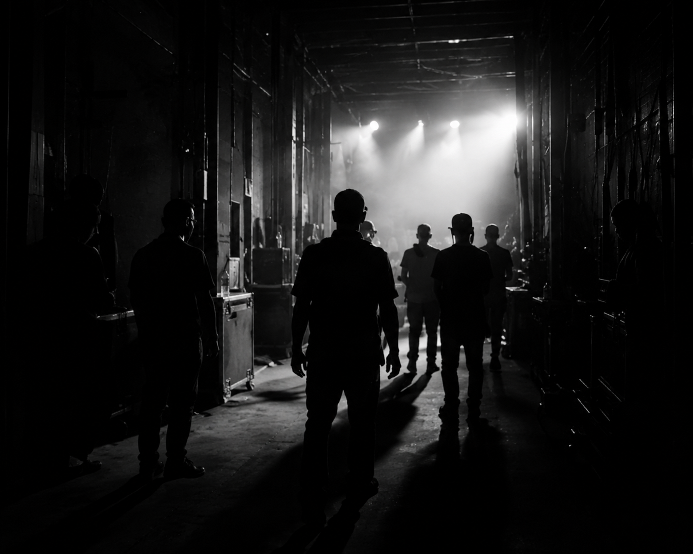 Musicians walking through backstage corridor